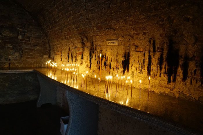 Candles burning in monastery