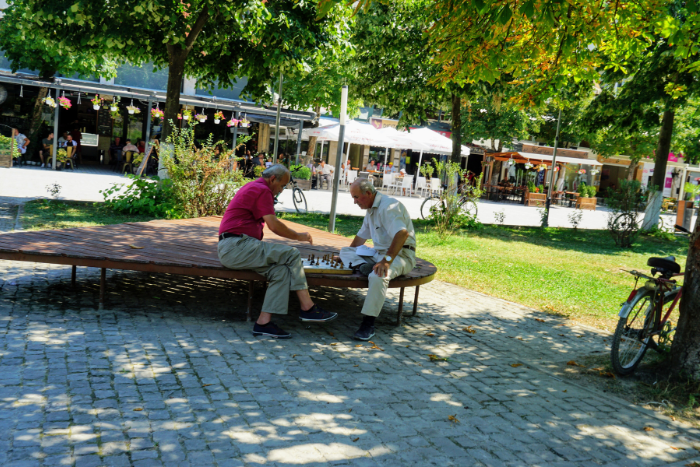 Men playing chess in Berat